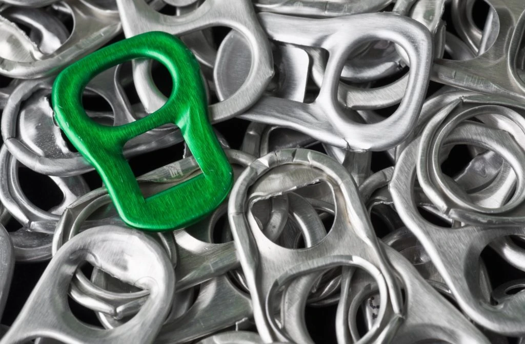 Aluminum can tabs, one in green